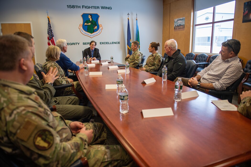 Photo of Vermont’s Lt. Gov. David Zuckerman talking with both the 158th Fighter Wing command team along with the 158th Fighter Wing honorary commanders during a meeting at the Vermont Air National Guard Base, South Burlington, Vermont, Jan. 26, 2023.