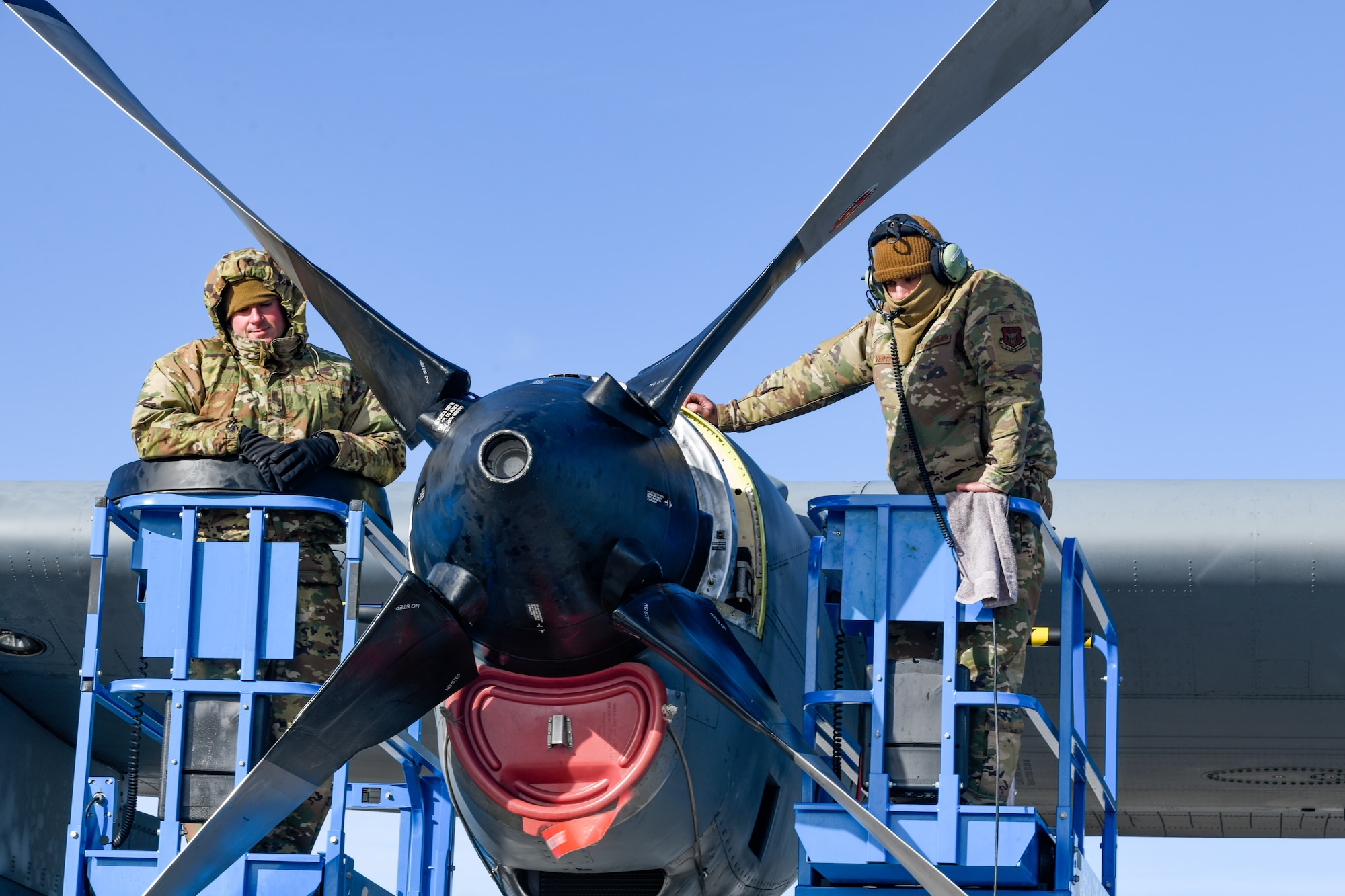Senior Airman Anthony Bianco and Staff Sgt. Anthony Verterano, aerospace propulsion technicians assigned to the 910th Aircraft Maintenance Squadron, confirm propeller lock positions, Jan. 17, 2023, at Mountain Home Air Force Base, Idaho.