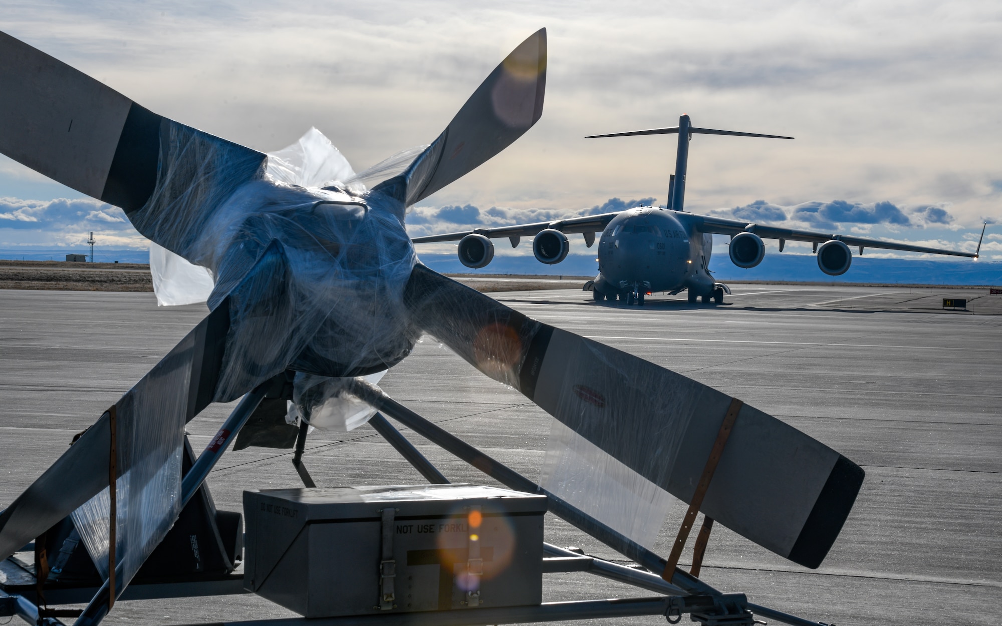 A C-17 Globemaster III aircraft from Pittsburgh Air Reserve Station, Pennsylvania, taxis after landing at Mountain Home Air Force Base, Idaho, Jan. 17, 2023, with aircrew and equipment from Youngstown Air Reserve Station, Ohio, needed to repair and test a 910th Airlift Wing C-130H Hercules aircraft.