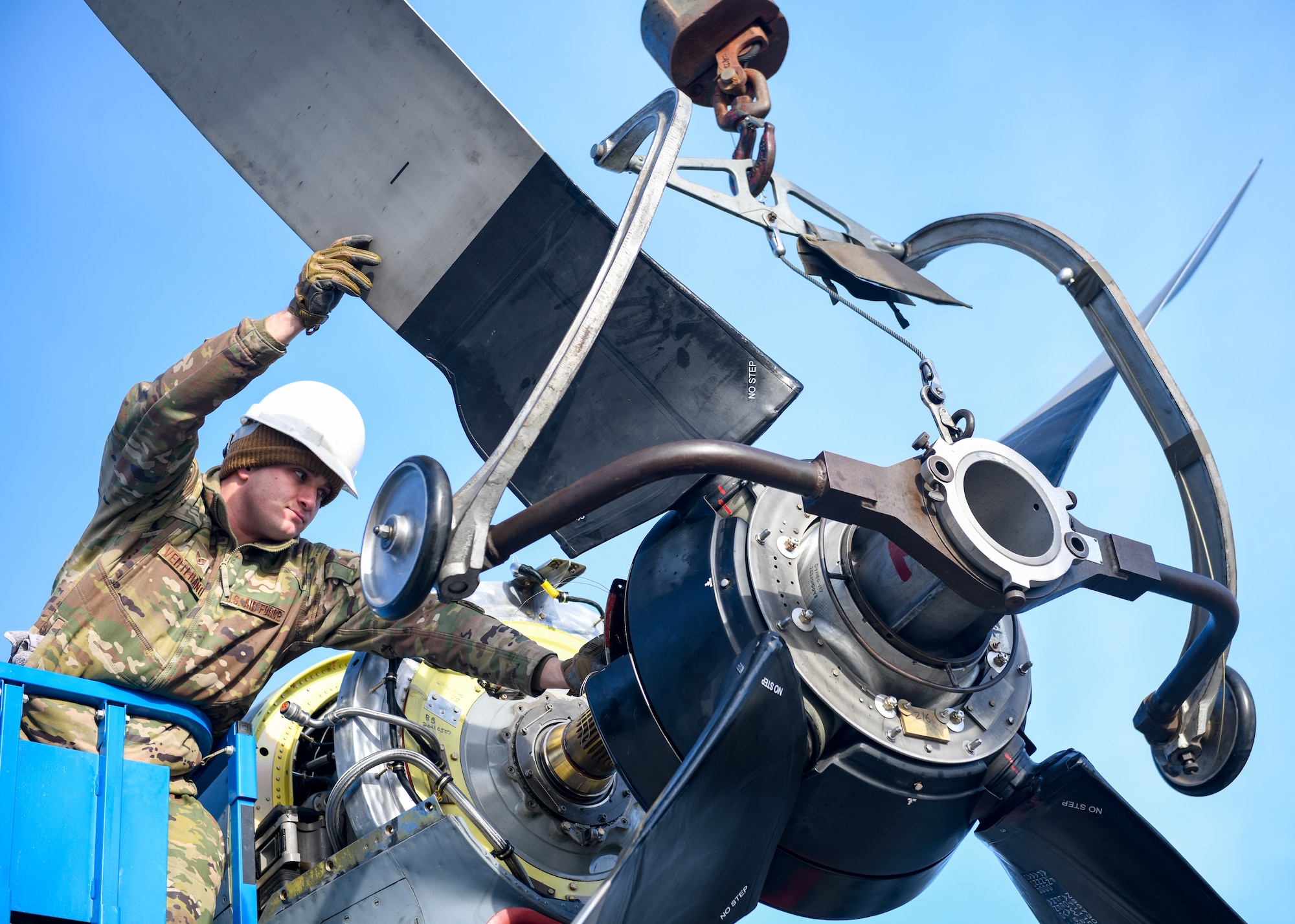 Staff Sgt. Anthony Verterano, an aerospace propulsion technician with the 910th Aircraft Maintenance Squadron, guides a propeller into position for installation onto a 910th Airlift Wing C-130H Hercules aircraft, Jan. 17, 2023, at Mountain Home Air Force Base, Idaho.