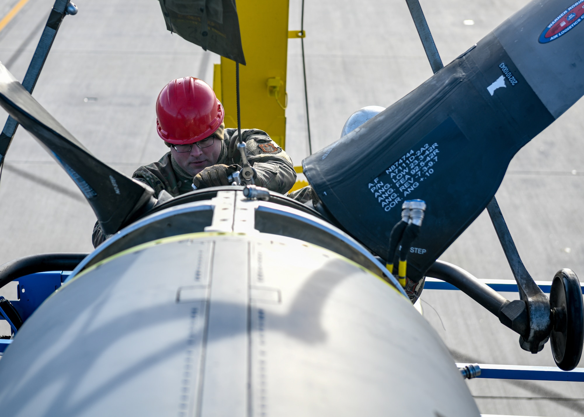 Tech. Sgt. William Wright, an aerospace propulsion technician with the 910th Aircraft Maintenance Squadron, installs a propeller onto a 910th Airlift Wing C-130H Hercules aircraft, Jan. 17, 2023, at Mountain Home Air Force Base, Idaho.