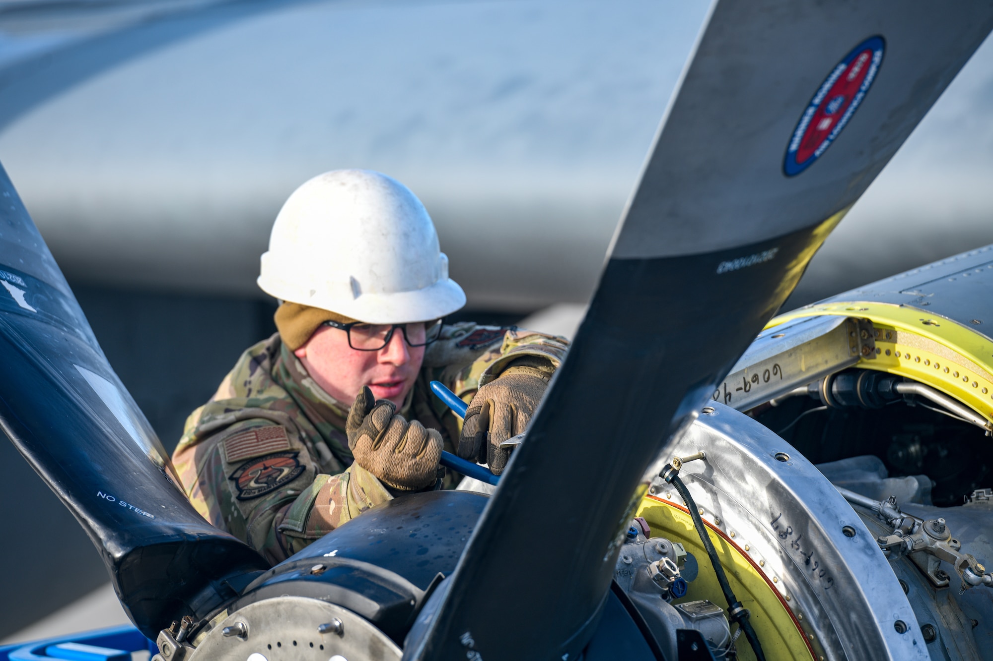 Staff Sgt. Kevin Johnson, an aerospace propulsion technician with the 910th Aircraft Maintenance Squadron, installs a propeller onto a 910th Airlift Wing C-130H Hercules aircraft, Jan. 17, 2023, at Mountain Home Air Force Base, Idaho.