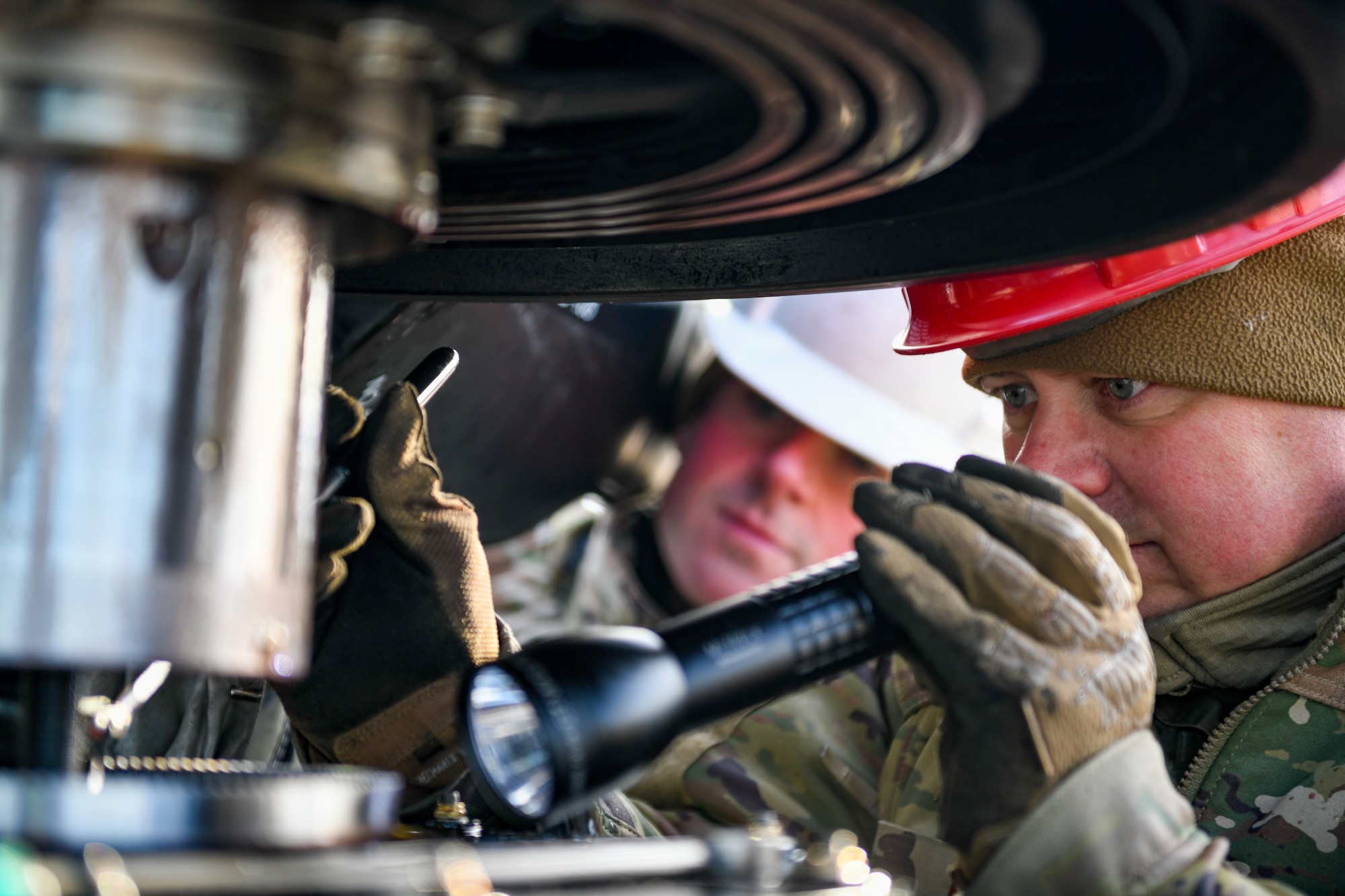 Tech. Sgt. Steven Lew, an aerospace propulsion technician assigned to the 910th Aircraft Maintenance Squadron, inspects a C-130H Hercules aircraft propeller, Jan. 17, 2023, at Mountain Home Air Force Base, Idaho.