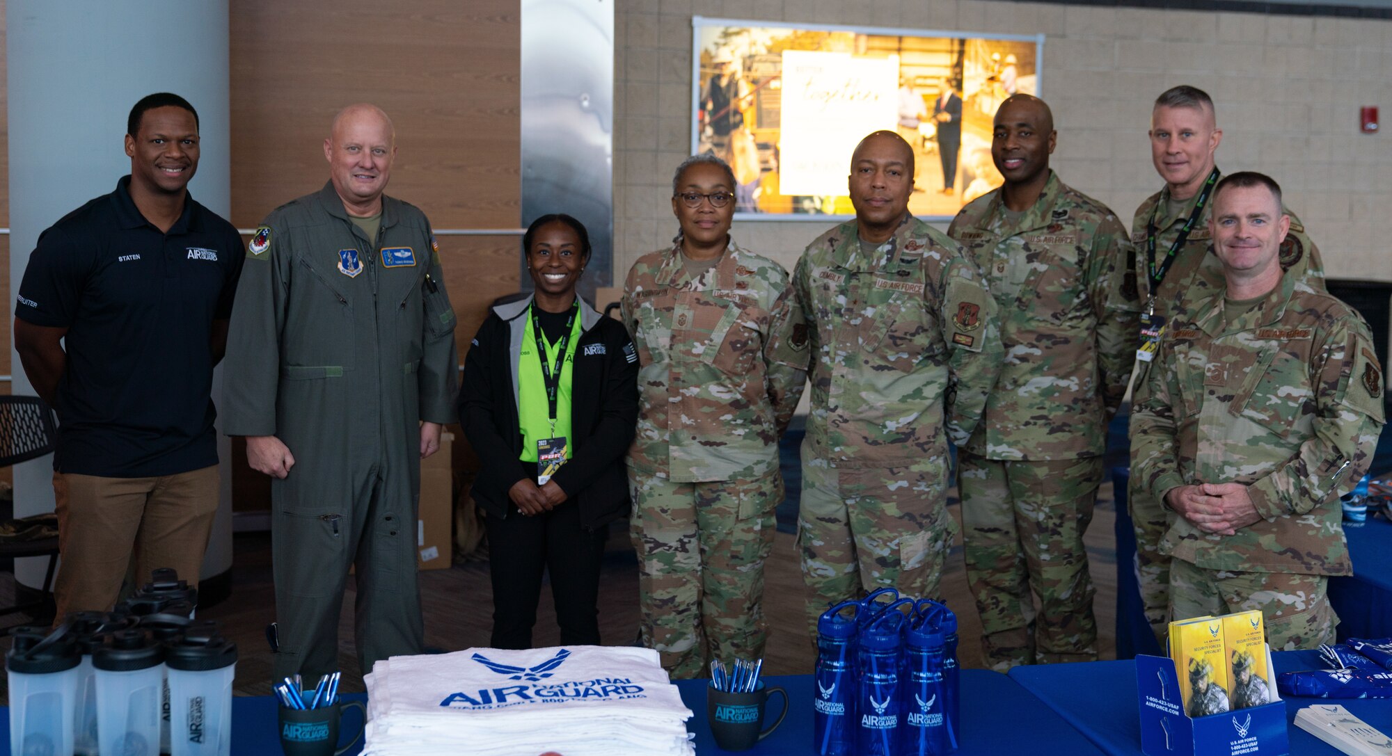 U.S. Air Force recruiters and representatives from the Air Force Reserve and Georgia Air National Guard pose for a photo at the Professional Bull Riders event “Unleash The Beast’s Gwinnett Chute Out” in Duluth, Ga. Jan. 22, 2023.