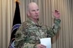 Man in uniform speaking