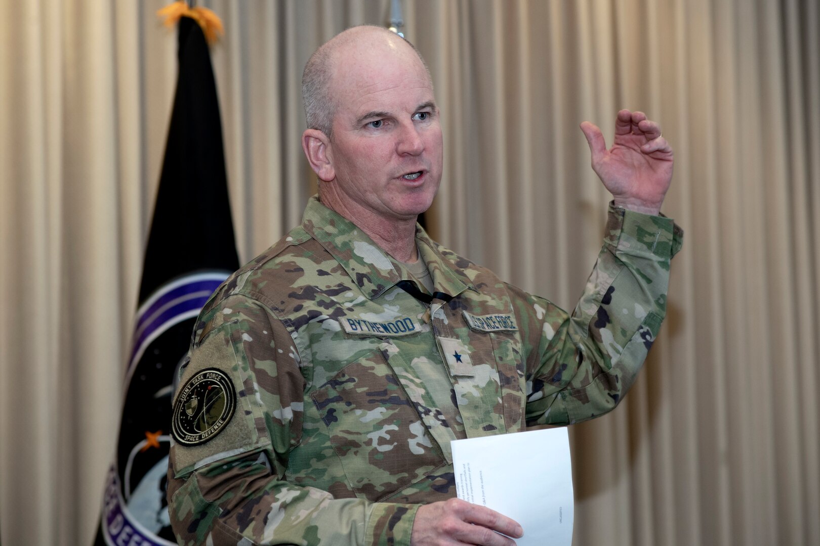 Man in uniform speaking