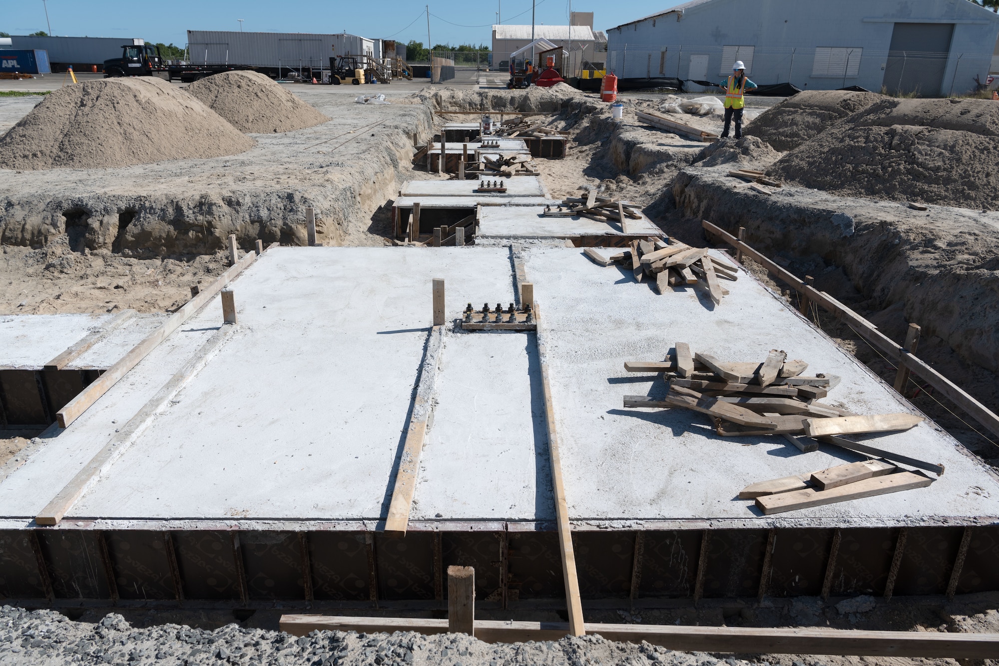 The Puerto Rico Air National Guard Contingency Response Facility construction site, overseen by Naval Facilities (NAVFAC) and being constructed by QB Group LLC at the 156th Wing, Muñiz Air National Guard Base, Carolina, Puerto Rico, Jan. 18, 2023. The CRF will house Contingency Response Group Airmen and equipment, allowing rapid mobilization of assets. (U.S. Air National Guard photo by Master Sgt. Rafael D. Rosa)