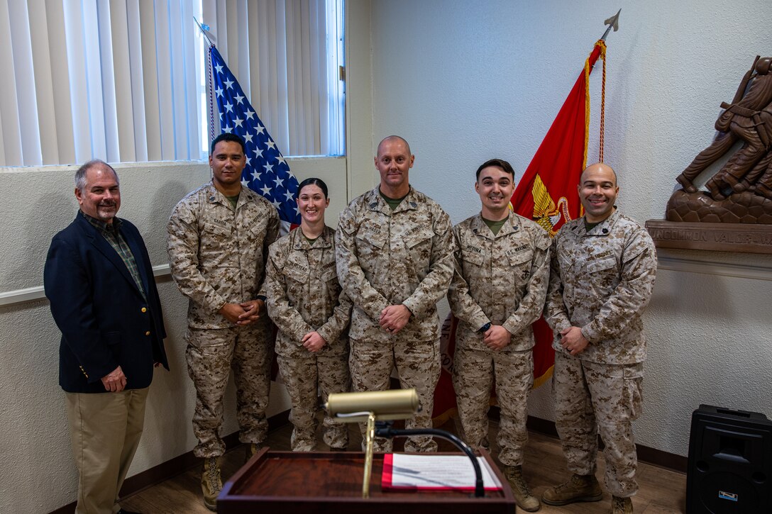 U.S. Marines and ASYMCA representatives from Marine Corps Air Ground Combat Center (MCAGCC), conclude a luncheon hosted by the Armed Services YMCA (ASYMCA) at MCAGCC, Twentynine Palms, California, Dec. 7, 2022. ASYMCA takes time every quarter to recognize a junior Marine and a non-commissioned officer stationed on MCAGCC for emulating good leadership, Marine Corps Values and hard work. (U.S. Marine Corps photo by Cpl. Jonathan Willcox)
