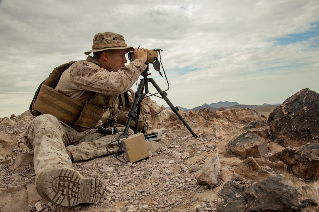 U.S. Marine Corps Cpl. Anthony Mercedes, a fire support Marine with 1st Air Naval Gunfire Liaison Company, I Marines Expeditionary Force Information Group, uses a common laser range finder- integrated capability during a live-fire, close-air support exercise at Barry M. Goldwater Range, Gila Bend, Arizona, July 26, 2022. 1st ANGLICO trains to enhance proficiency in CAS and expand digital communications capabilities. (U.S. Marine Corps photo by Lance Cpl. Amelia Kang)
