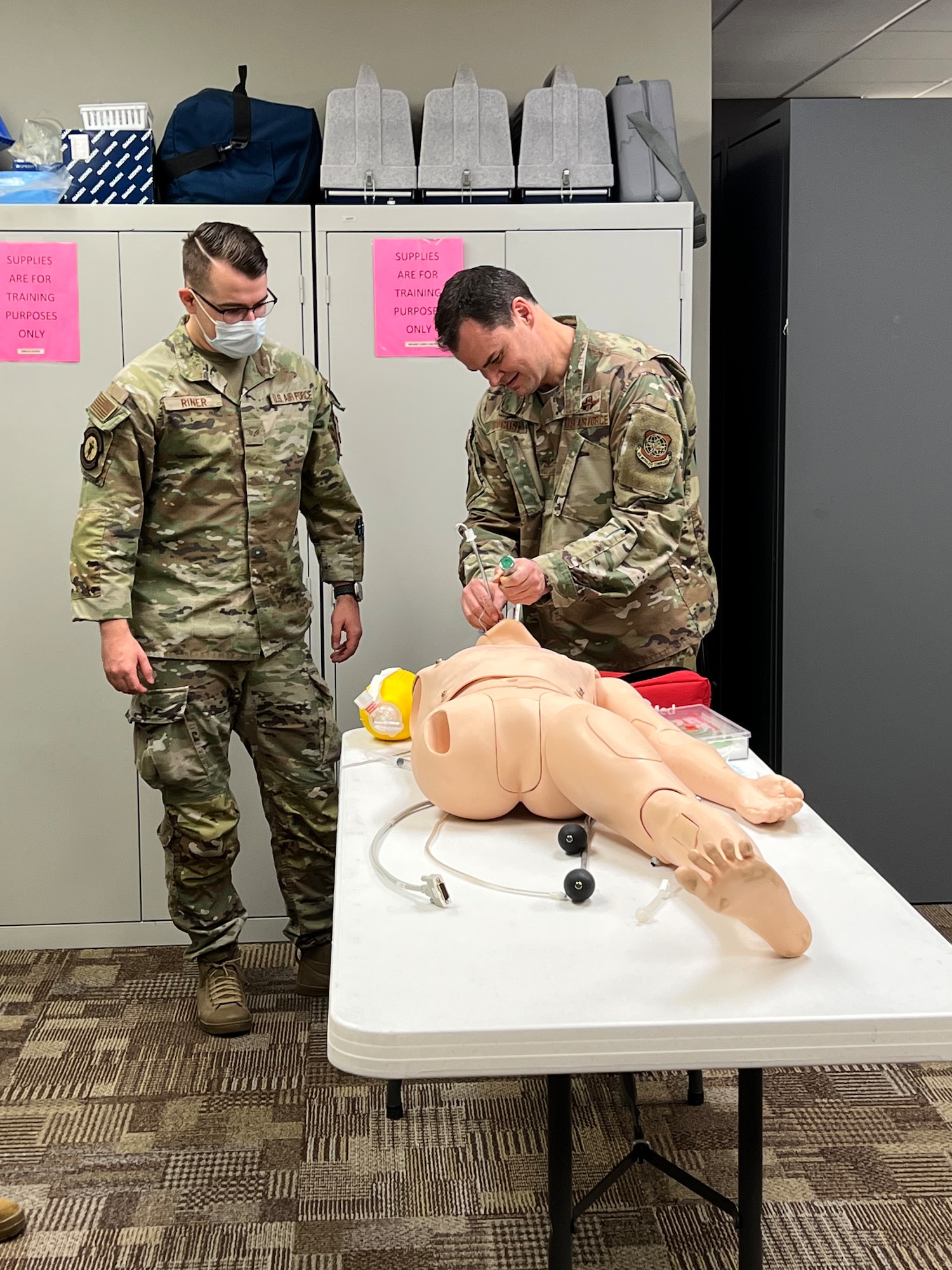 U.S. Air Force Senior Airman Taylor Riner, 97th Medical Group (MDG) independent medical duty technician, observes Col. Chesley Dycus, 92nd Air Refueling Wing commander, perform endotracheal intubation on a manikin at Altus Air Force Base, Oklahoma, Jan. 20, 2023. Airmen from the 97th MDG provides prevention-oriented healthcare to more than 9,500 beneficiaries in the local community. (courtesy photo by 1st Lt. Carla Gonzalez)