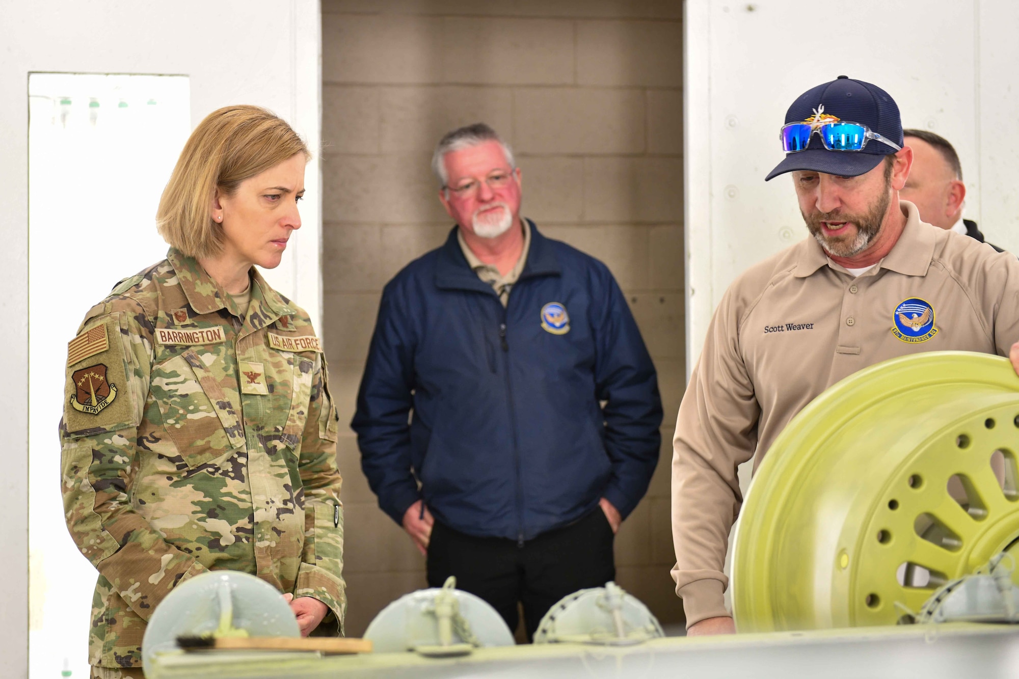 Scott Weaver, 97th Maintenance Squadron corrosion section chief, shows U.S. Air Force Col. Catherine Barrington a wheel well in Hangar 285 at Altus Air Force Base, Oklahoma, Jan. 20, 2013. Airmen from the 97th Maintenance Group recently developed a new method of creating its own KC-46 Pegasus wheels - the first unit in the U.S. Air Force to do so. (U.S. Air Force photo by Airman 1st Class Kari Degraffenreed)