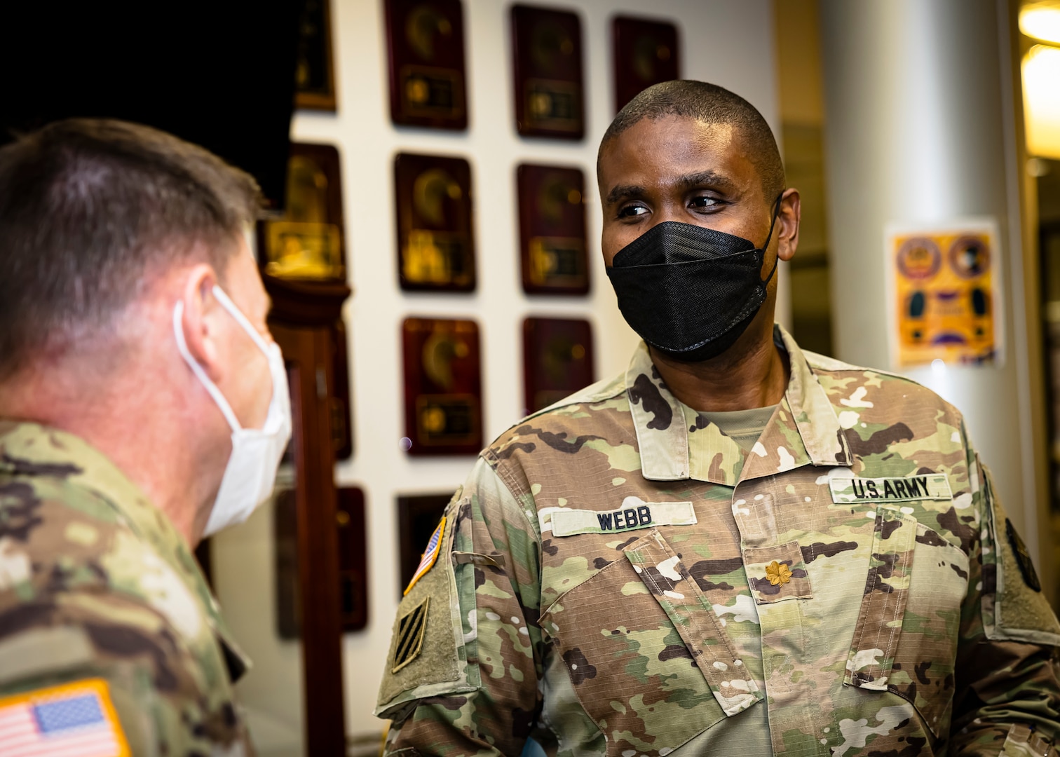 Maj. Cameron Webb (right), Fort Lee Military Entrance Processing Station commander, talks to U.S. Army Col. James D. Hoyman, Fort Lee garrison commander, January 25, 2023, about Fort Lee MEPS achieving excellence, as evidenced by its award ‘MEPS of the Year’ at a celebration at Fort Lee, Va. As one of United States Military Entrance Processing Command’s 21 ‘large’ MEPS, Fort Lee competed against 64 other MEPS across the country to include Alaska, Hawaii, and Puerto Rico, winning MEPS of Excellence for two quarters and unit pennants the other two quarters in FY22. (U.S. Army photo by Chad Menegay)