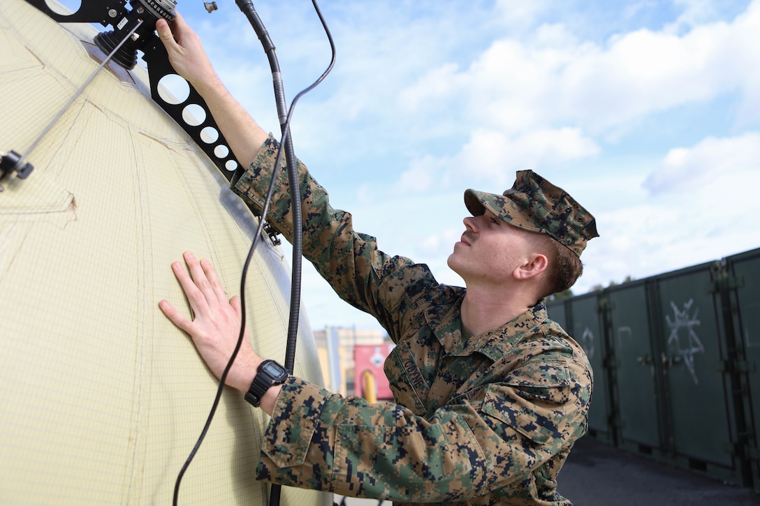 U.S. Marine Corps Lance Cpl. Tyler Coyne, a signals intelligence system administrator with 1st Radio Battalion, I Marine Expeditionary Force Information Group, conducts a function check on an odin sphere during a preventative maintenance inspection at Marine Corps Base Camp Pendleton, California, Jan. 11, 2023. Signals intelligence system administrators support the transmission and receiving of special intelligence via various hardware and software systems. (U.S. Marine Corps photo by Cpl. Amelia Kang)