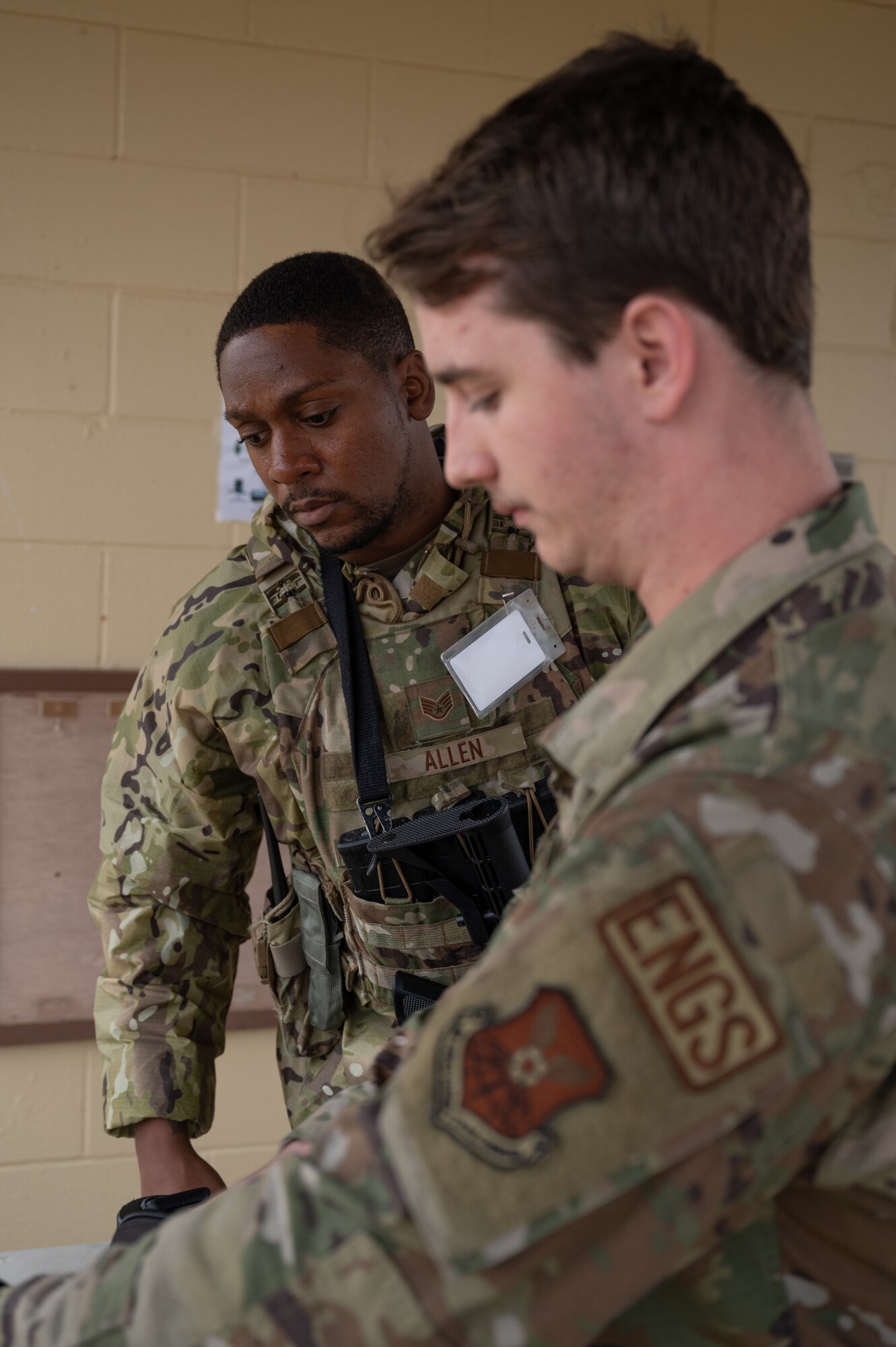 Staff Sgt. Jacory Allen, 2nd Security Forces Squadron non-commissioned officer in-charge of plans and programs, inspects the contents of a backpack during exercise Bayou Vigilance at Barksdale Air Force Base, La., Jan. 18, 2023.