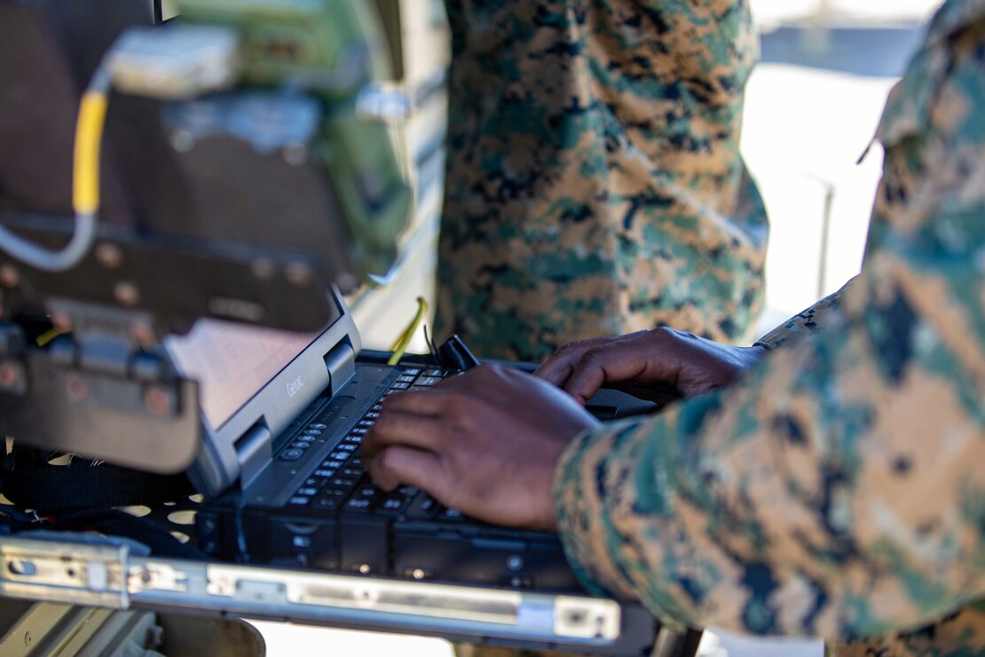 U.S. Marine Corps Cpl. Ahmed Spence, a satellite communications operator with 9th Communication Battalion, I Marine Expeditionary Force Information Group, sets up connection on the Very Small Aperture Terminal at Marine Corps Base Camp Pendleton, California, March 11, 2022. This training allows the 9th Communication Battalion to be capable of operating, defending, and preserving information networks to enable command and control for the commander in all domains, and support and conduct Marine Air Ground Task Force operations in the information environment. (U.S. Marine Corps photo by Cpl. Alize Sotelo)1
