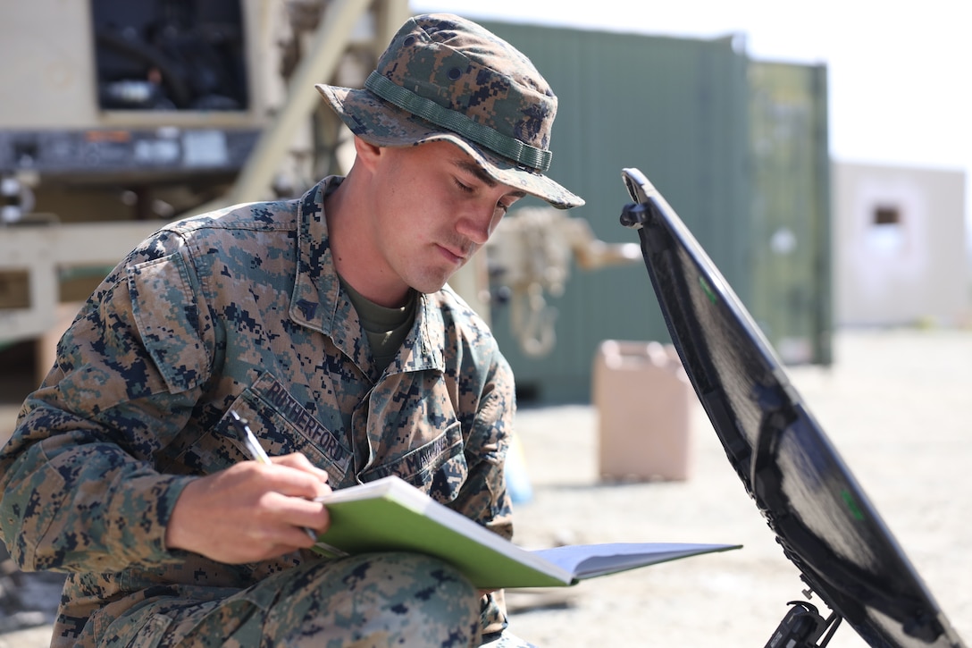U.S. Marine Corps Cpl. Andrew Rutherford, a satellite transmissions system operator with 9th Communication Battalion, I Marine Expeditionary Force Information Group, troubleshoots satellite communication during a combat readiness evaluation at Marine Corps Base Camp Pendleton, California, March 16, 2022. The Marines with 9th Communication Battalion established internet service and enhanced the capability of operating, defending, and preserving network operations in the information environment.  (U.S. Marine Corps photo by Cpl. Aidan Hekker)