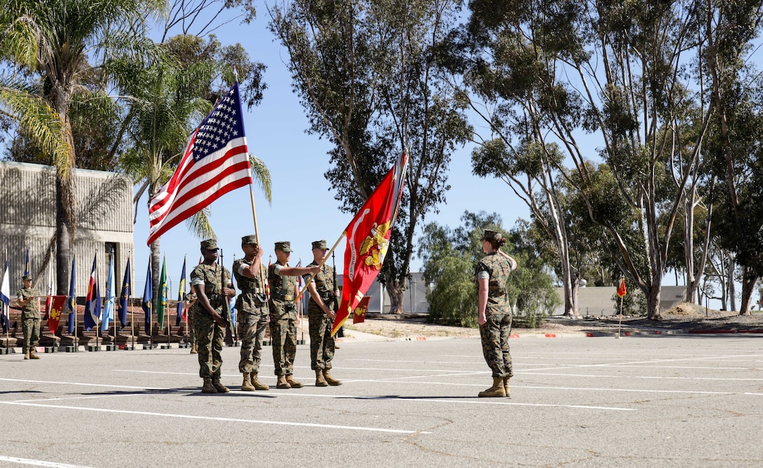 U.S. Marine Corps Gunnery Sgt. Katya Rubisoff, troop commander with 9th Communication Battalion, I Marine Expeditionary Force Information Group prepares the color guard in the 9th Comm relief and appointment ceremony on Marine Corps Base Camp Pendleton, California, April 15, 2022. Sgt. Maj. Beau D. Brenneis relinquished his post to Sgt. Maj. Allen E. Smith. (U.S. Marine Corps photo by Cpl. Alize Sotelo)