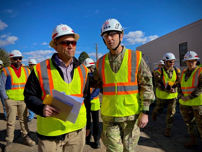 Lt. Gen. Scott Spellmon (right), commanding general, U.S. Army Corps of Engineers, speaks with Phil Lovato, southern area office area engineer, USACE-Albuquerque District, during his visit at a project site at White Sands Missile Range, New Mexico, Jan. 24, 2023.