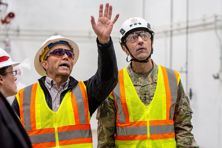 Lt. Gen. Scott Spellmon (right), commanding general, U.S. Army Corps of Engineers, speaks with Phil Lovato, southern area office area engineer, USACE-Albuquerque District, during his visit at a project site at White Sands Missile Range, New Mexico, Jan. 24, 2023.
