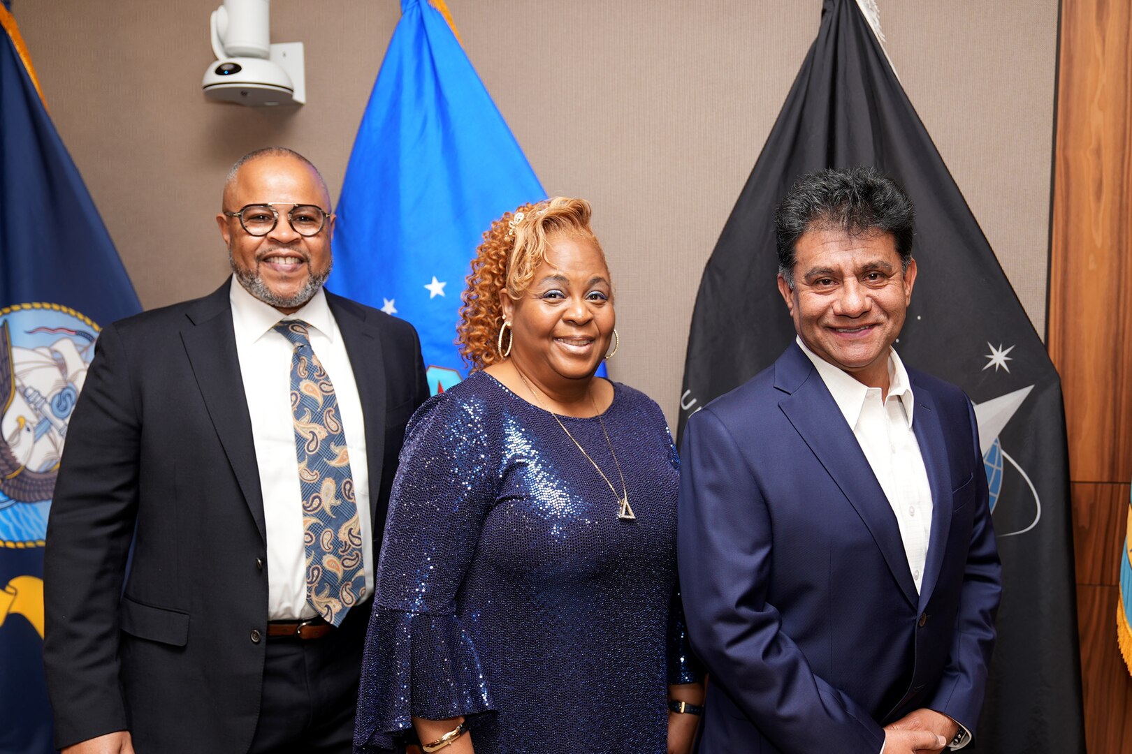 Raymond Hosey, left, Rhonda Johnson, center, and Cesar Galvis Rodriguez, right, pose together during their retirement ceremony in Philadelphia on Jan. 26, 2023.  DLA Troop Support, located in Philadelphia, is a Major Subordinate Command of the Defense Logistics Agency, with a global presence including offices in Europe & Africa and the Pacific regions.