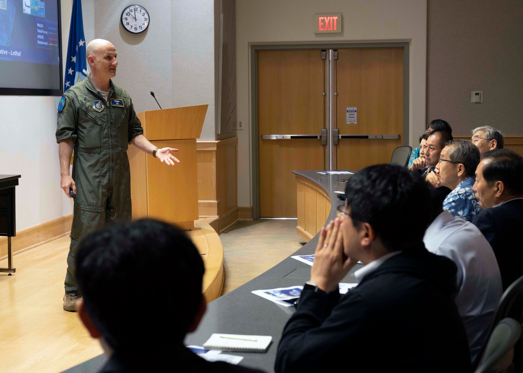 Photo of Japan Defense Society members being brief by a U.S. Air Force service member.