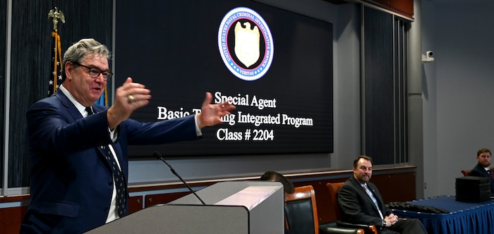 General Counsel for the Department of the Navy, The Honorable Sean Coffey, gives a speech to graduates of NCIS Special Agent Class.