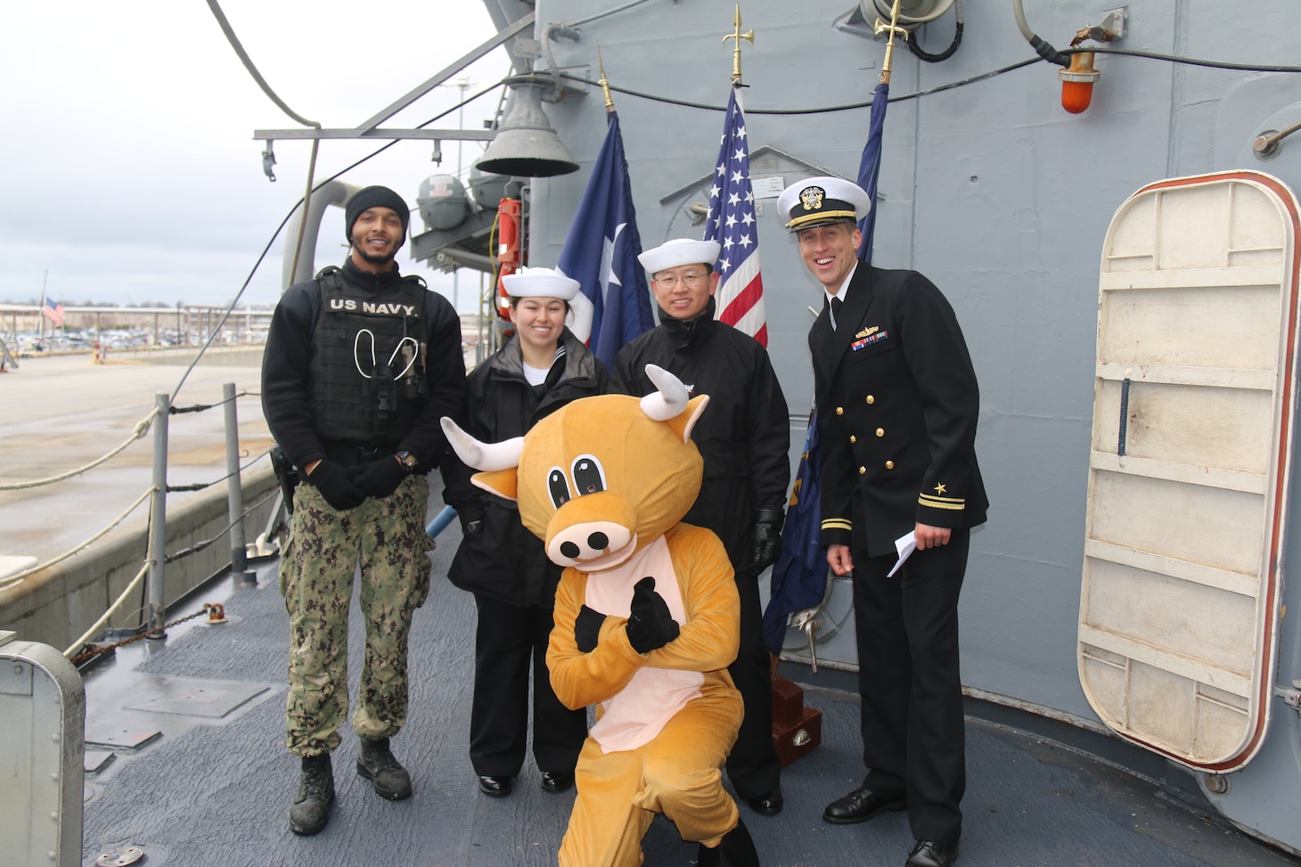 NORFOLK, Va. (Jan. 23, 2023) Crew members of the Ticonderoga-class guided-missile cruiser USS San Jacinto (CG 56) pose with the ship mascot during a tour of the ship in celebration of their 35-year commissioning anniversary, Jan. 23, 2023. San Jacinto is currently in port onboard Naval Station Norfolk
