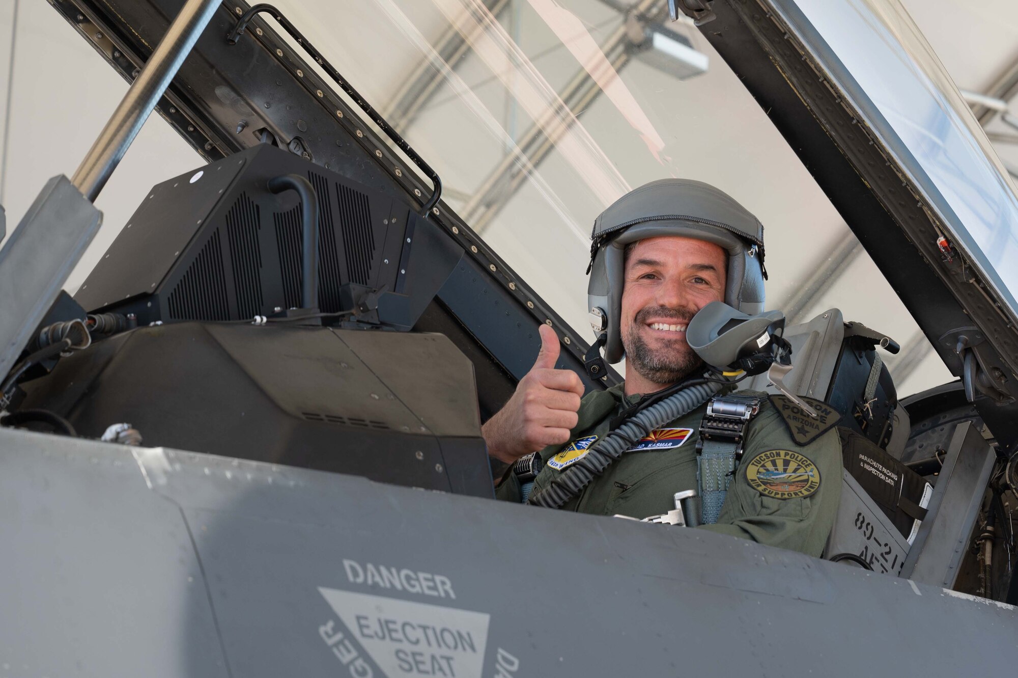 Chad Kasmar, Tucson Police Department Chief of Police, gives a thumbs-up signal before taking flight in an F-16 with Col. Brant Putnam, the 162nd Wing Vice Commander, as his pilot. (U.S. Air Force photo by Maj. Angela Walz)