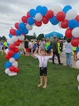 Reeve completes a 2022 summer triathlon. Reeve was assisted by Lt. Col. Cassandra Burns, 88th Medical Group pediatric neurologist, after being diagnosed with a rare case of cerebral folate deficiency at four years old, along with being diagnosed with down syndrome at birth. (Courtesy Photo)