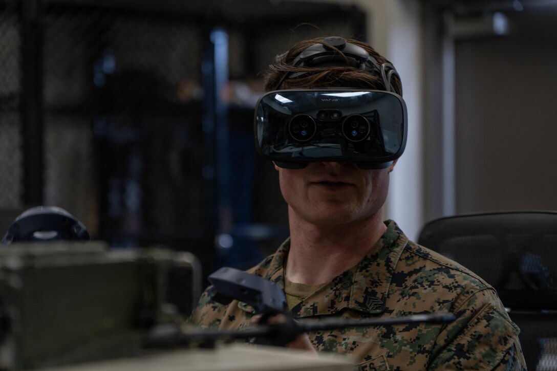 U.S. Marine Corps Sgt. Mason Whatley, a radio operator with 1st Air Naval Gunfire Liaison Company, I Marine Expeditionary Force Information Group, uses a Varjo XR-3 mixed reality headset during 1st ANGLICO certification exercise 2-23 at Marine Corps Base Camp Pendleton, California, Jan. 11, 2023. The first week of CERTEX 2-23 covers immersive simulation training in order to certify firepower control teams for future integration with other units. (U.S. Marine Corps photo by Lance Cpl. Joseph Helms)