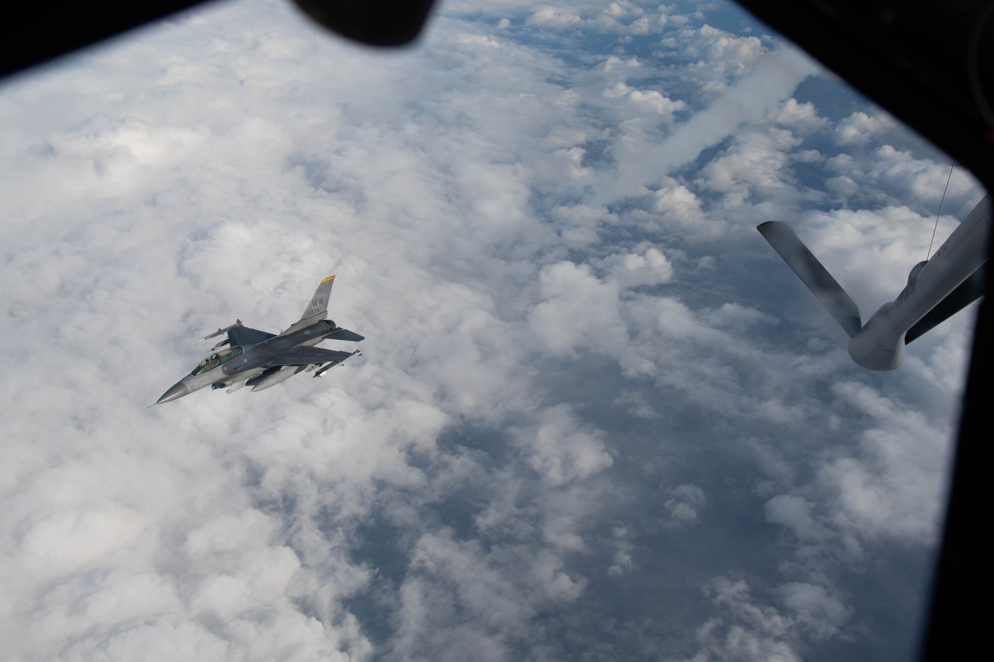 An aircraft conducts aerial refueling.