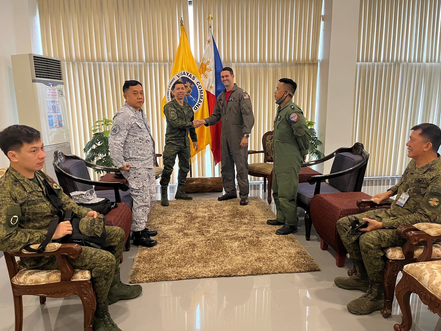 Lt. Gen. Benedict M. Arevalo, Philippine Visayas Commander and Army 3rd Infantry Division, and Cmdr. Marc Hines, commanding officer of the “Red Lancers” of Patrol Squadron (VP) 10, shake hands during a meeting as part of a weeklong engagement promoting joint regional security and partnerships out of Mactan, Philippines. VP-10 is based in Jacksonville, Florida and is currently operating from Kadena Air Base in Okinawa, Japan. It conducts maritime patrol and reconnaissance, as well as theater outreach operations, as part of a rotational deployment to the U.S. 7th Fleet area of operations. (U.S. Navy photo by Lt. j.g. Travis Goebel)