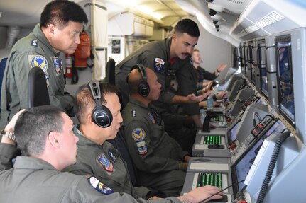 Naval Aircrewman (operator) 2nd Class William Pottenger (top) and Naval Aircrewman (operator) 3rd Class Justin Fruci, both assigned to the “Red Lancers” of Patrol Squadron (VP) 10, explain mission work stations during a tour of a P-8A Poseidon as part of a weeklong engagement promoting joint regional security and partnerships out of Mactan, Philippines. VP-10 is based in Jacksonville, Florida and is currently operating from Kadena Air Base in Okinawa, Japan. It conducts maritime patrol and reconnaissance, as well as theater outreach operations, as part of a rotational deployment to the U.S. 7th Fleet area of operations. (U.S. Navy photo by Lt. j.g. Travis Goebel)