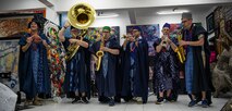 230129-N-DK722-1008 (Jan. 29, 2023) LAGOS, Nigeria -- The Topside Brass Band of the U.S. Naval Forces Europe-Africa Band, while wearing traditional Nigerian garments, perform at the Nike Art Foundation in Lagos, Nigeria, Jan. 29, 2023, during exercise Obangame Express 2023. Obangame Express 2023, conducted by U.S. Naval Forces Africa, is a maritime exercise designed to improve cooperation, and increase maritime safety and security among participating nations in the Gulf of Guinea and Southern Atlantic Ocean. U.S. Sixth Fleet, headquartered in Naples, Italy, conducts the full spectrum of joint and naval operations, often in concert with allied and interagency partners, in order to advance U.S. national interests and security and stability in Europe and Africa. (U.S. Navy photo by Mass Communication Specialist 1st class Cameron C. Edy)