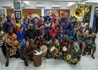 230129-N-DK722-1014 (Jan. 29, 2023) LAGOS, Nigeria – Chief Dr. Nike Davies-Okundaye, center row and fifth from left, Jesse King Buga, center row and third from left, artists from the Nike Art Foundation and members of the U.S. Naval Forces Europe-Africa Band pose for a photo at the Nike Art Foundation in Lagos, Nigeria, Jan. 29, 2023, during exercise Obangame Express 2023. Obangame Express 2023, conducted by U.S. Naval Forces Africa, is a maritime exercise designed to improve cooperation, and increase maritime safety and security among participating nations in the Gulf of Guinea and Southern Atlantic Ocean. U.S. Sixth Fleet, headquartered in Naples, Italy, conducts the full spectrum of joint and naval operations, often in concert with allied and interagency partners, in order to advance U.S. national interests and security and stability in Europe and Africa. (U.S. Navy photo by Mass Communication Specialist 1st class Cameron C. Edy)