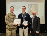 Photo of Christopher Sheerer (middle), Depot Commander Col. Daniel L. Horn (left) and Deputy Commander Robert Lantka (right).