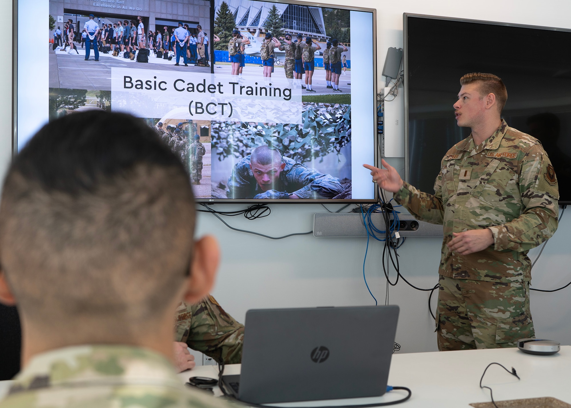 U.S. Air Force 2nd Lt. Daniel Leitzinger, an information operations officer assigned to Air Force Special Operations Command, Hurlburt Field, Florida, briefs Airmen from the 659th Intelligence, Surveillance and Reconnaissance Group, about commissioning through the U.S. Air Force Academy, Jan. 26, 2023, at Fort George G. Meade, Maryland. Leitzinger, a prior enlisted member and 659th ISRG alumni, shared his personal experiences from the academy’s Basic Cadet Training program. The 659th ISRG hosted the event, which informed Airmen about how to commission through the U.S. Air Force Academy. The U.S. Air Force offers enlisted members various paths to commission as an officer through programs such as the Academy, Leader Encouraging Airmen Development, and Officer Training School. (U.S. Air Force photo by Staff Sgt. Kevin Iinuma)