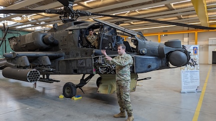 U.S. Army 1st Lt. Sean Schlagel, an aviation officer assigned to Bravo Company, 1st Battalion, 3rd Aviation Regiment (Attack Battalion), 12th Combat Aviation Brigade, gives an overview of the capabilities of the AH-64D Apache Longbow helicopter during a professional development event in Katterbach, Germany, Jan. 4, 2023. The event, organized for Soldiers assigned to Task Force Orion, 27th Infantry Brigade Combat Team, New York Army National Guard, followed their training in the Army’s military decision-making process, and helped them understand how to incorporate aviation and air defense assets into planning for combat operations.