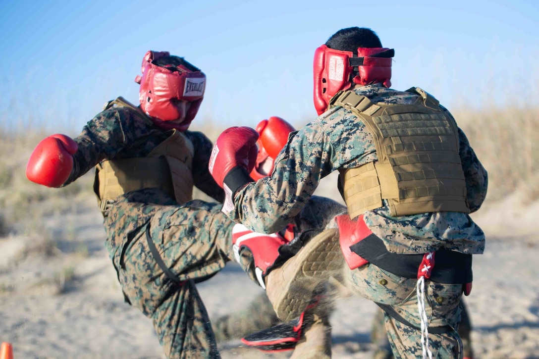 U.S. Marine Corps 1st Lt. Thomas R. Grover, left, a deputy staff judge advocate, and Cpl. Erick Gonzalezaldaz, right, a data systems administrator, both with Fleet Marine Force, Atlantic, Marine Forces Command, Marine Forces Northern Command, body spar during a Martial Arts Instructor Course culminating event at Naval Air Station Oceana, Dam Neck, Va., Jan. 27, 2023. The MAIC is designed to develop the individual Marine’s understanding of combative techniques while enduring both mental and physical stressors in order to establish a warrior's ethos. Marines graduating the course become certified instructors and are able to teach Marine Corps Martial Arts Program techniques to their individual units across the Marine Corps.