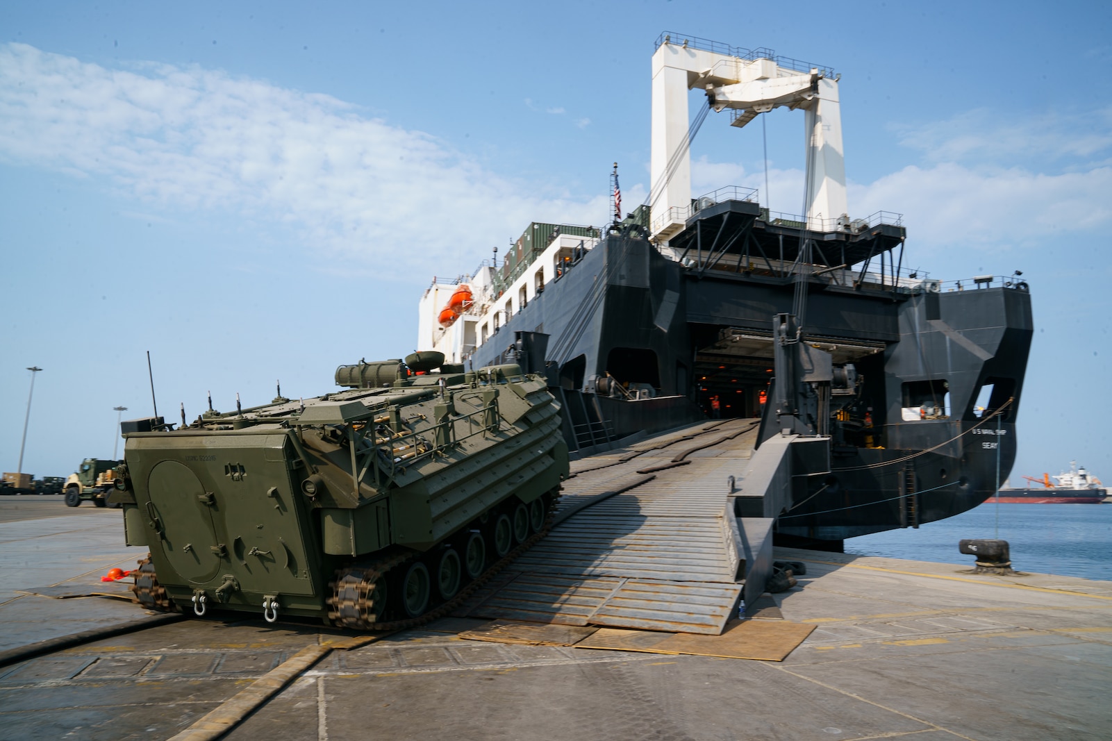 U.S. Marines assigned to Combat Logistics Regiment 1, 1st Marine Logistics Group, load an A1 Assault Amphibious Vehicle (AAV-P7) onto the USNS Seay (T-AKR-302) during exercise Native Fury 22 at the Yanbu Commercial Port, Kingdom of Saudi Arabia