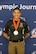 Man in U.S. Army competition uniform standing with medal around neck.
