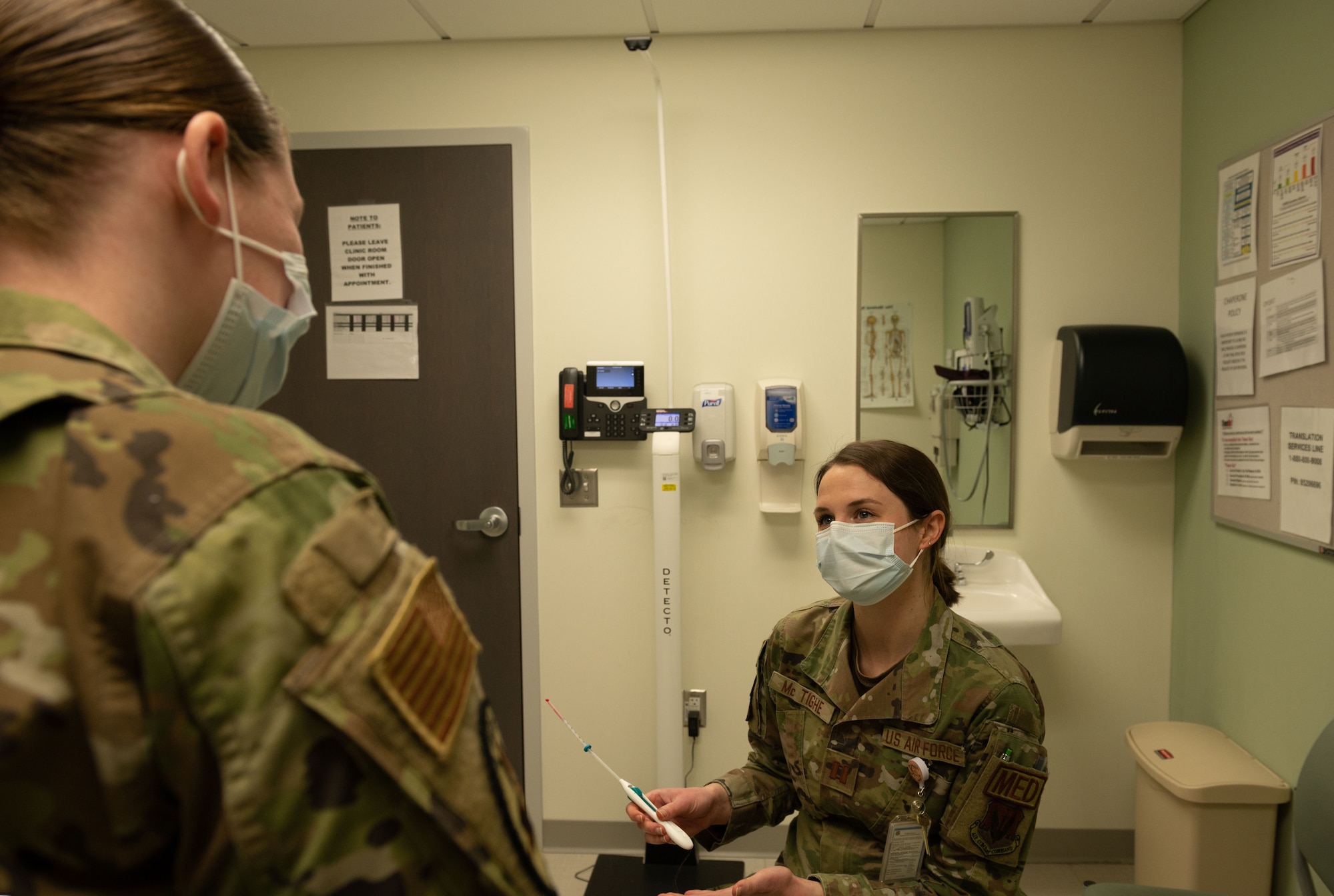 Capt. Krystal Mc Tighe, 4th Medical Group family physician, speaks to patient about an IUD at Seymour Johnson Air Force Base, North Carolina, Jan. 30, 2023. Active-duty females now have access to long-term contraceptives, which includes oral contraceptive, patches, rings, shots, rods, natural family planning and intrauterine devices through the walk-in clinic at the 4th Medical Group. (U.S. Air Force photo by Rebecca Sirimarco-Lang)