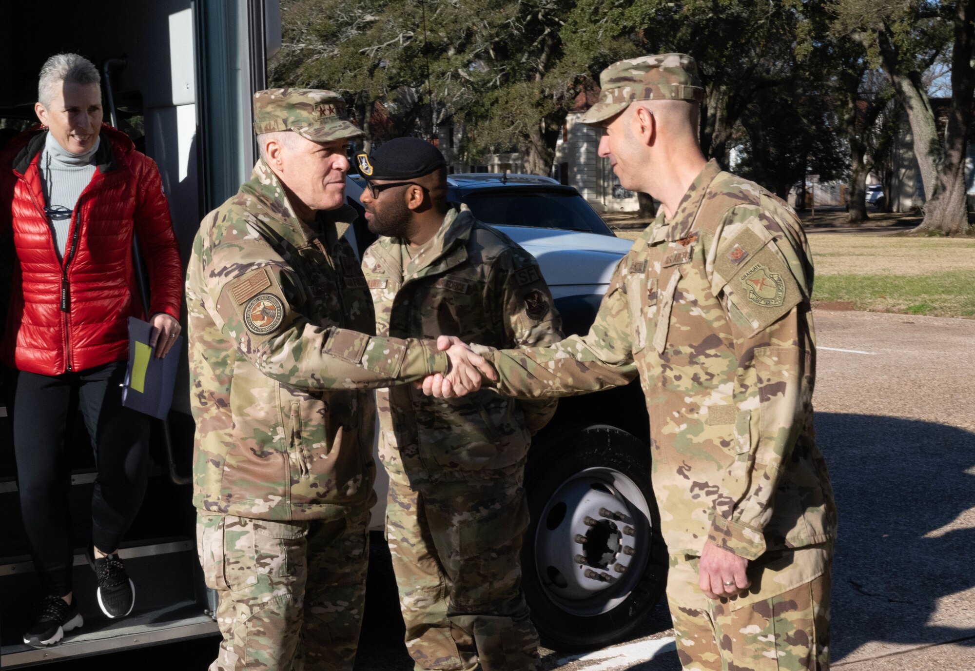 U.S. Air Force Gen. Thomas Bussiere, Air Force Global Strike Command (AFGSC) commander, greets Col. Joseph McKenna, 2nd Bomb Wing vice commander, outside the wing headquarters building during a tour, Barksdale Air Force Base, La., Jan. 26, 2023.