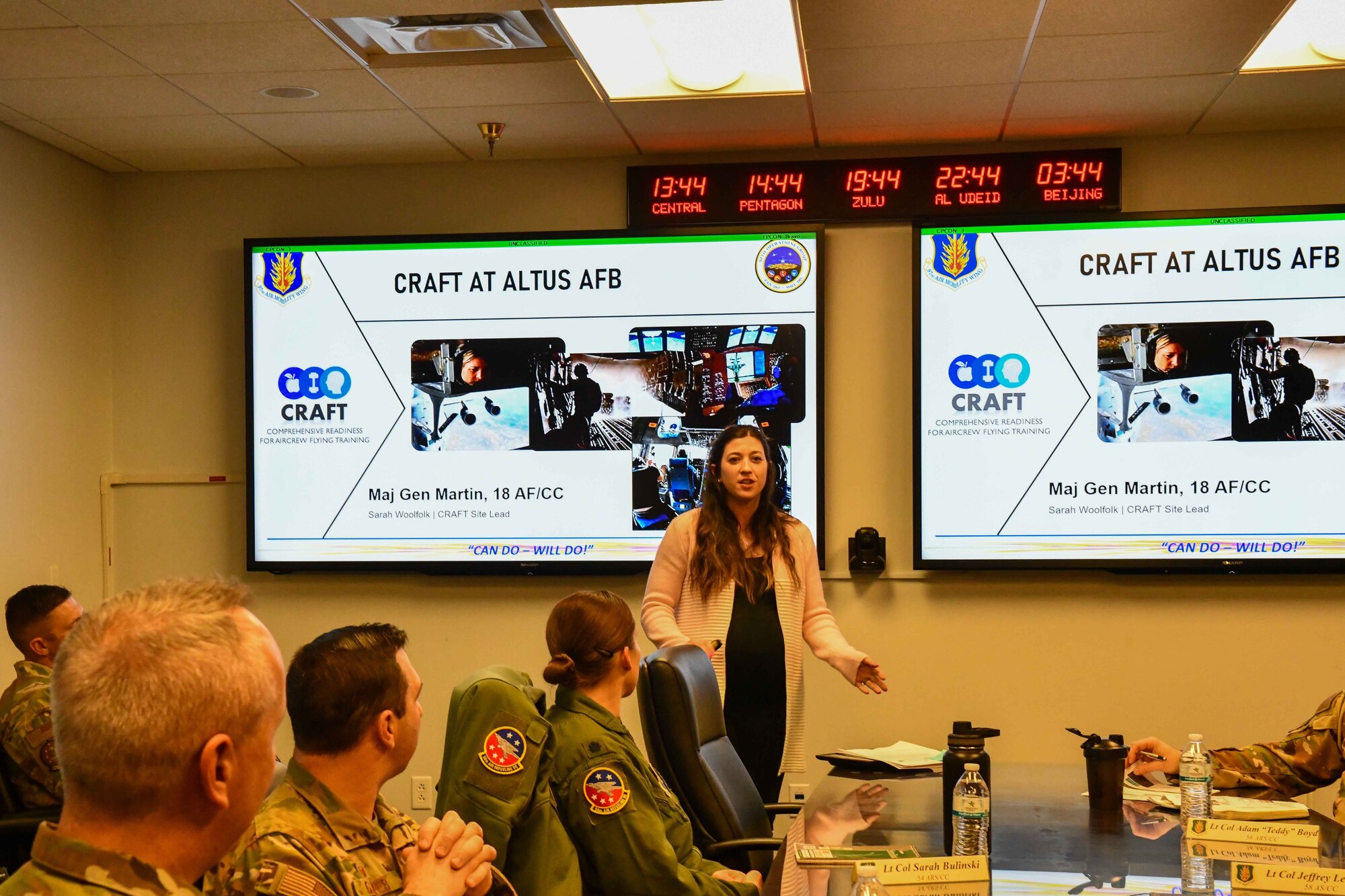 Sarah Woolfolk, cognitive specialist and site lead for the Comprehensive Readiness for Aircrew Flying Training (CRAFT) program, presents a slideshow for Gen. Corey Martin, 18th Air Force Commander, at Altus Air Force Base (AAFB), Oklahoma, Jan. 26, 2023. Woolfolk first arrived at AAFB in Sept. 2022 to begin building the CRAFT program. (U.S. Air Force photo by Airman 1stClass Miyah Gray)