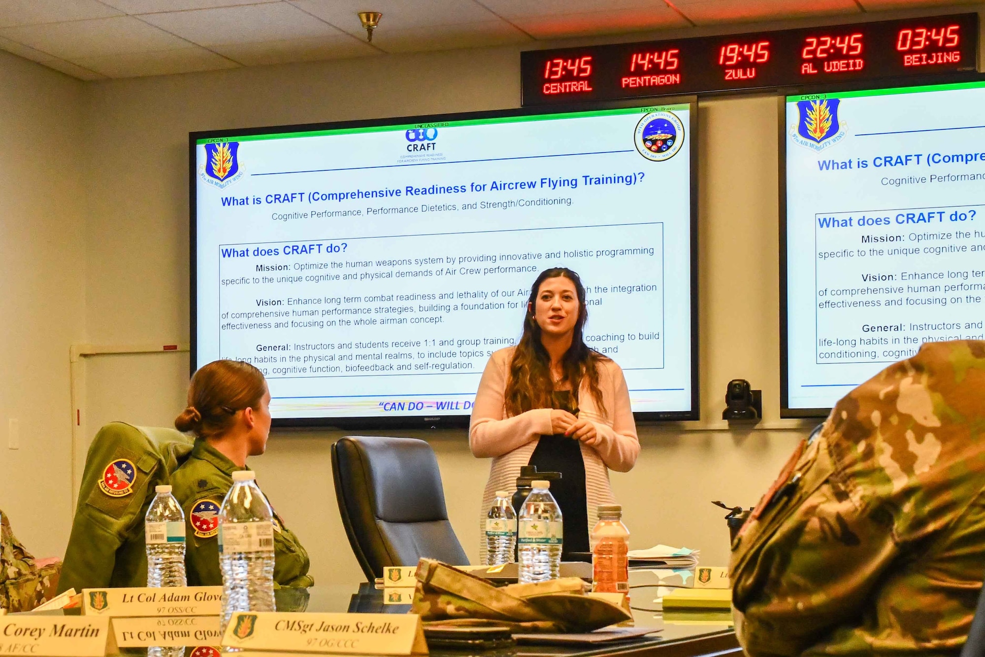 Sarah Woolfolk, cognitive specialist and site lead for the Comprehensive Readiness for Aircrew Flying Training (CRAFT) program, explains what CRAFT is to Gen. Corey Martin, 18th Air Force Commander, at Altus Air Force Base, Oklahoma, Jan. 26, 2023. CRAFT or similar programs have spread to a number of different Air Force training bases to improve aircrew performance.(U.S. Air Force photo by Airman 1st Class Miyah Gray)