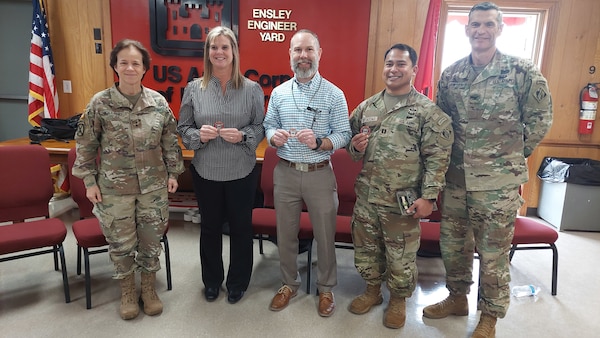 Earlier this week, the Memphis District hosted a Flood Risk Management exercise involving multiple federal organizations including the Mississippi Valley Division.  Mississippi Valley Division Commander Maj. Gen. Diana Holland (far left) recognized (from left to right) Memphis District Emergency Manager Kandi Waller, Hydraulics & Hydrology Branch Chief Mike Clay, and Captain Sean Tedtaotao for their superb planning and execution of the exercise. Memphis District Commander Col. Brian Sawser (far right) joined in to congratulate his team.