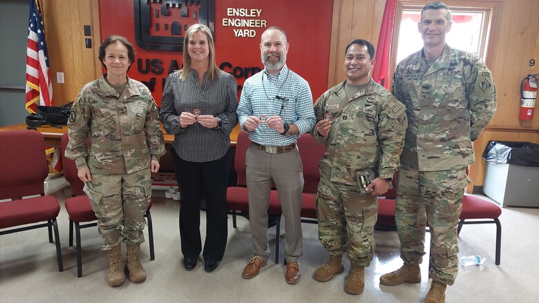 Earlier this week, the Memphis District hosted a Flood Risk Management exercise involving multiple federal organizations including the Mississippi Valley Division.  Mississippi Valley Division Commander Maj. Gen. Diana Holland (far left) recognized (from left to right) Memphis District Emergency Manager Kandi Waller, Hydraulics & Hydrology Branch Chief Mike Clay, and Captain Sean Tedtaotao for their superb planning and execution of the exercise. Memphis District Commander Col. Brian Sawser (far right) joined in to congratulate his team.