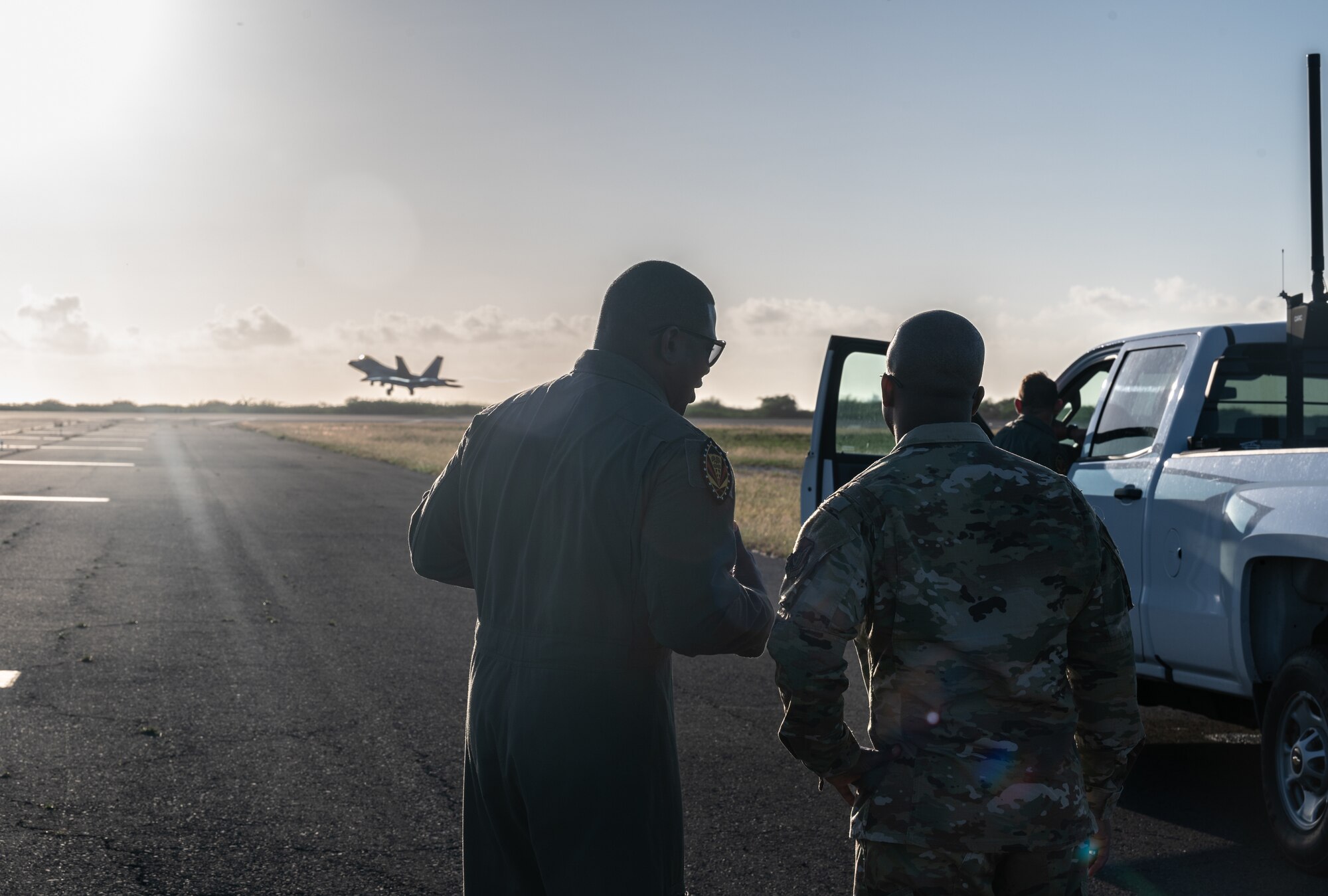 Lt. Col. Paul Lopez, 19th Fighter Squadron commander, speaks to Chief Master Sgt. Anthony Thompson Jr., 15th Wing command chief, during an F-22 Raptor demonstration at Joint Base Pearl Harbor-Hickam, Hawaii, Jan. 24, 2023. The 19th FS is comprised of active-duty Airmen who work as a part of a total force team alongside the Hawaii Air National Guard’s 199th Fighter Squadron. (U.S. Air Force photo by Staff Sgt. Alan Ricker)