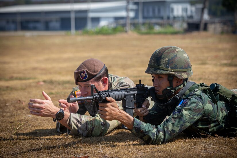 Maneuver Advisor Team 5221, 5th Security Force Assistance Brigade, provides instruction on movement and maneuver tactics as well as hand and arm signals in preparation during combat patrol training with the 112th Royal Thai Army Striker Battalion, 11th RTA Infantry Division, Jan. 15, 2023, in Ko Chan, Thailand.  MAT 5221 will spend a total of six months working with members of the RTA in preparation for a rotation to the United States Military Academy's Sandhurst Competition at West Point, New York this spring.
