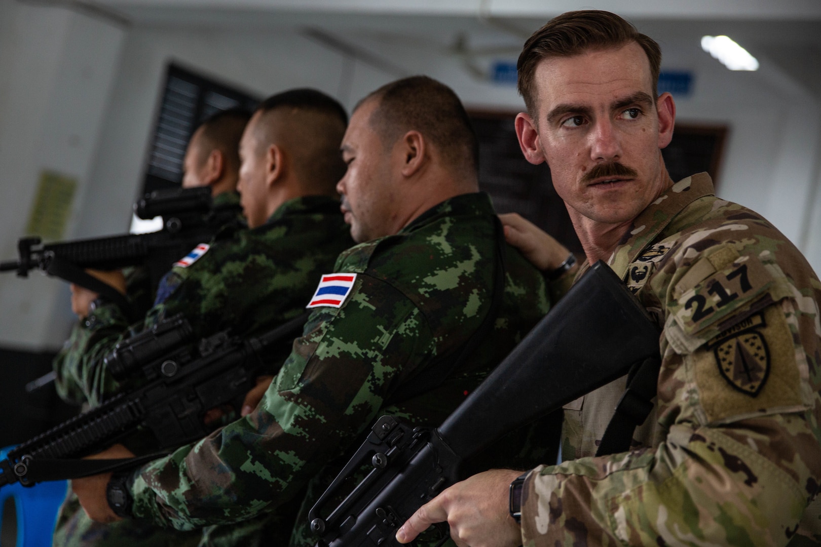 Sgt. 1st Class Justin Babb takes part in close quarters battle rehearsals with members of the Royal Thai Army. Babb is part of an SFAB Team assigned to Force Package 23-1, the 5th SFAB's forward-deployed element.
